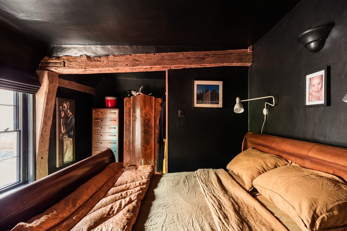 Rustic Wooden Elements in a Historic English House 13 all black bathroom exposed wooden beams