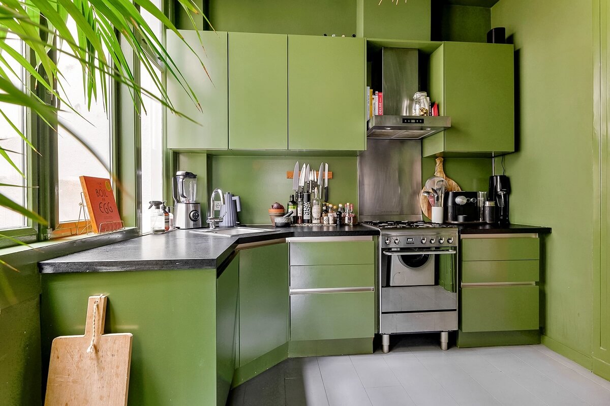 An Amsterdam Apartment with Surprising Bold Color Accents 8 all green kitchen