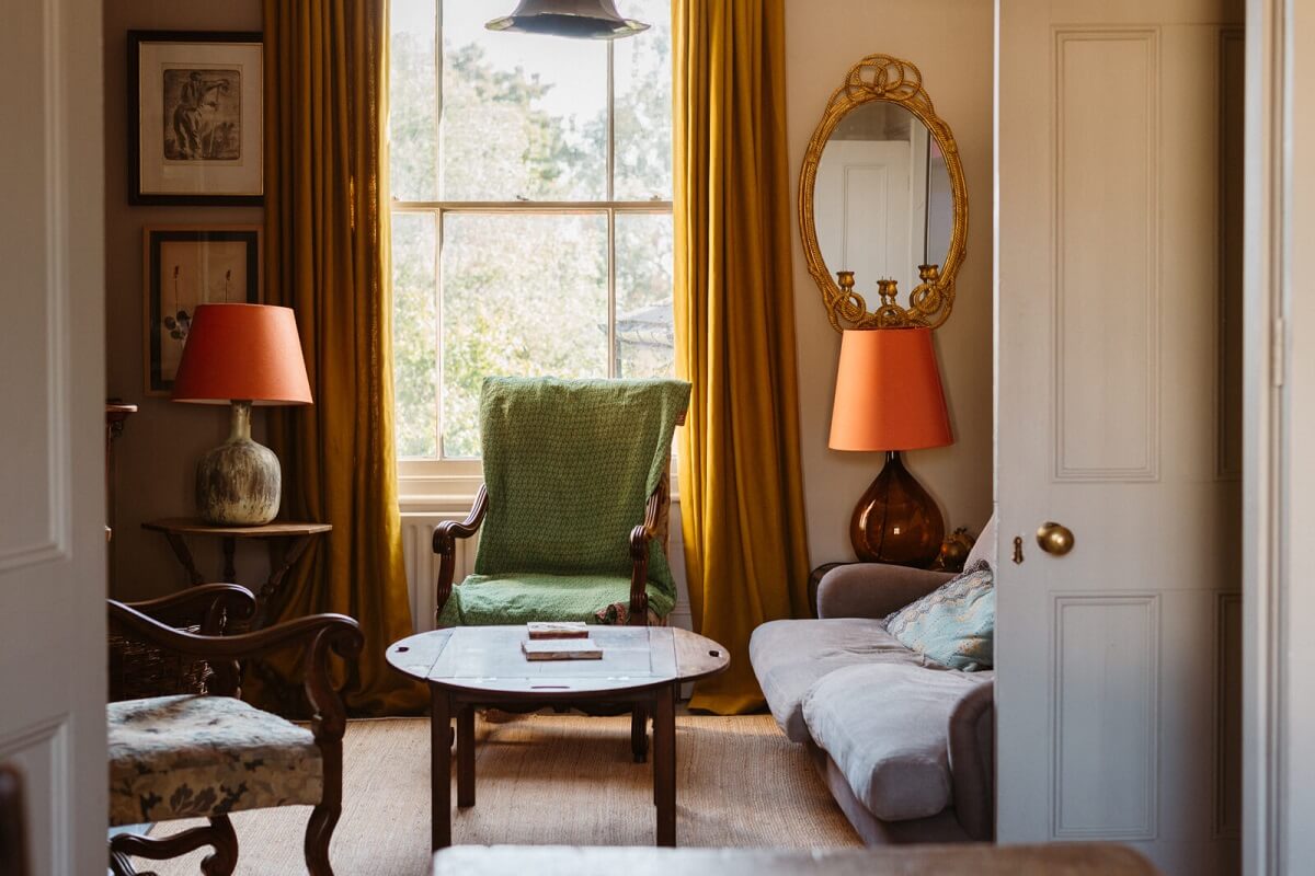 A Cozy Victorian House with Warm Color Accents 1 antique-living-room-colorful-accents-nordroom