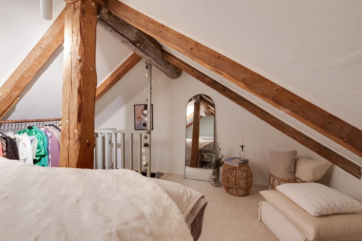 attic bedroom slanted ceilings wooden beams