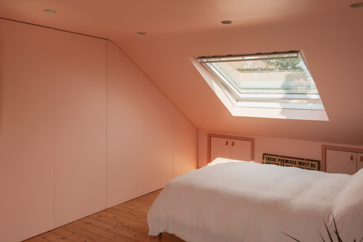 Exposed Brick and Wooden Beams in an Extended London Home 31 attic bedroom storage under slanted ceiling