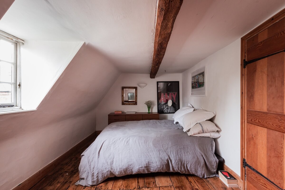 Rustic Wooden Elements in a Historic English House 19 attic bedroom wooden floorboards exposed beam