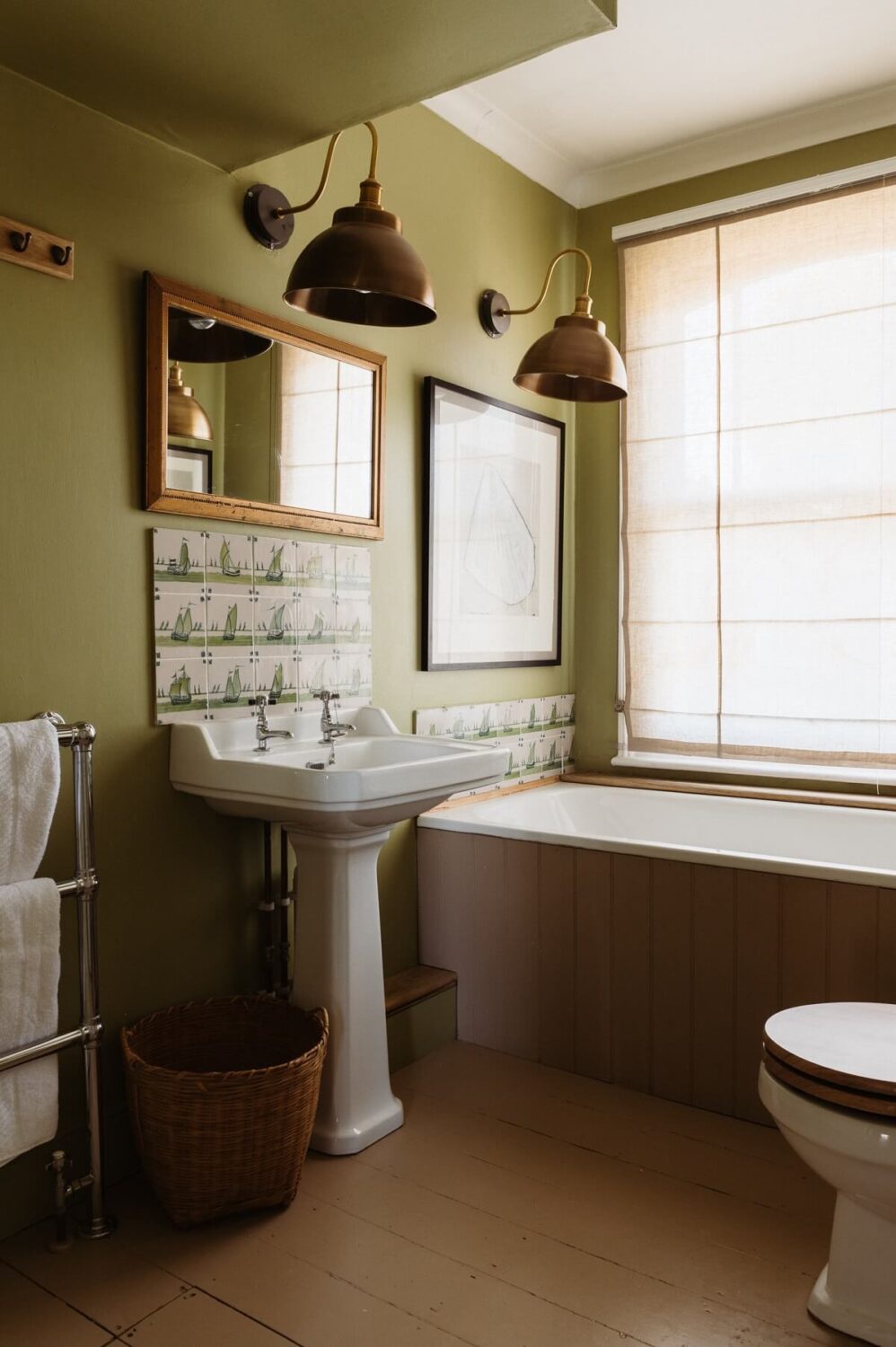 A Cozy Victorian House with Warm Color Accents 14 bathroom-bath-under-window-vintage-tiles-nordroom