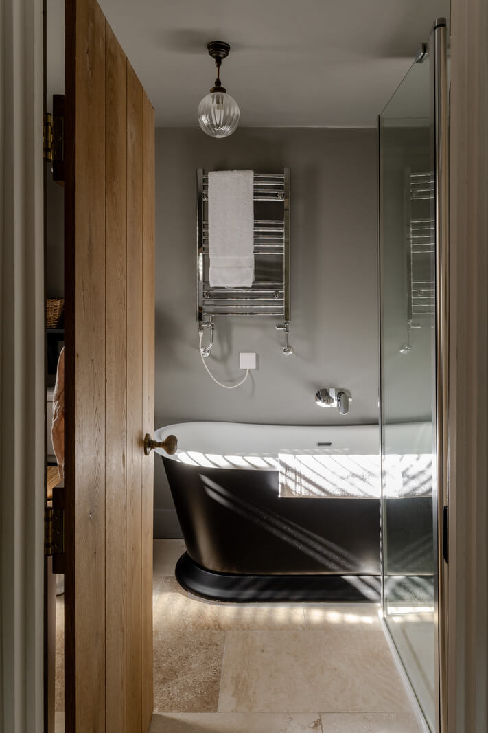 A Charming Stone Cottage with Period Features in Cornwall 16 bathroom black tub