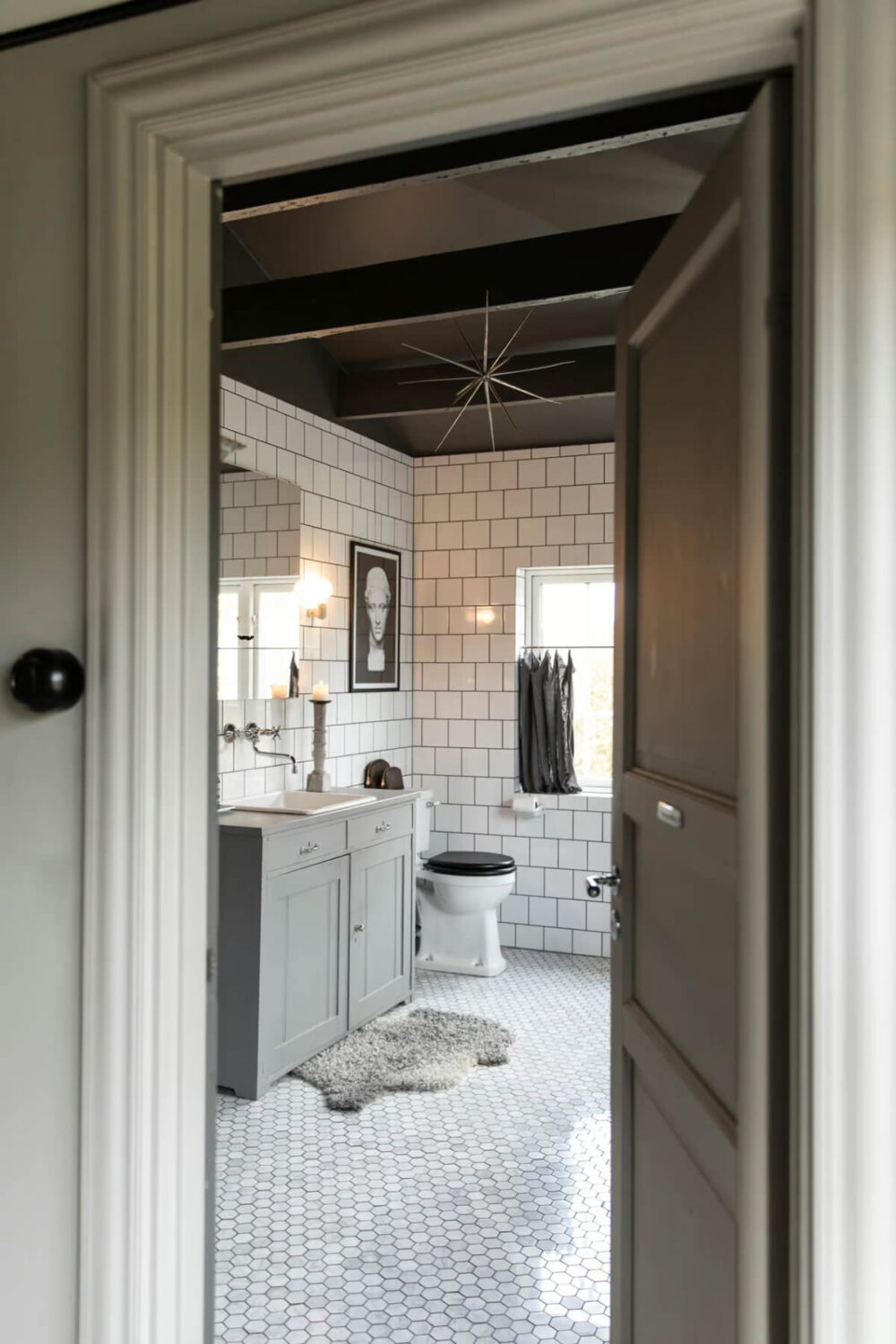 An Open-Plan Gray Home in a Former Textile Factory 15 bathroom carrara marble floor tiles gray ceiling nordroom