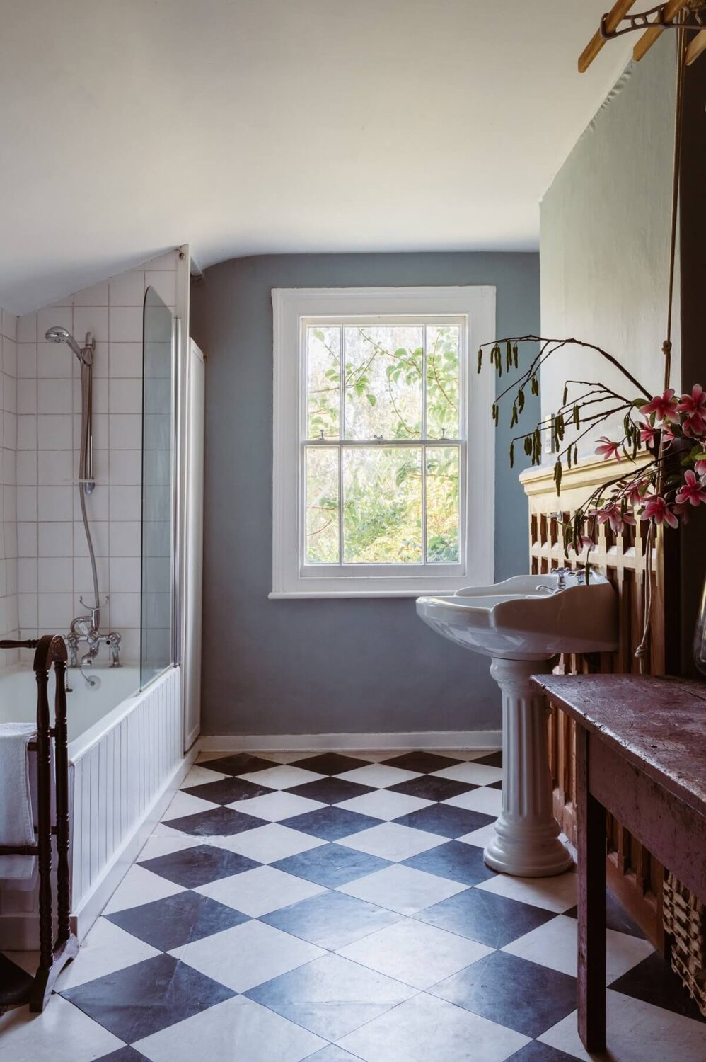 A Cozy Victorian House with Warm Color Accents 19 bathroom-checkerboard-floor-nordroom