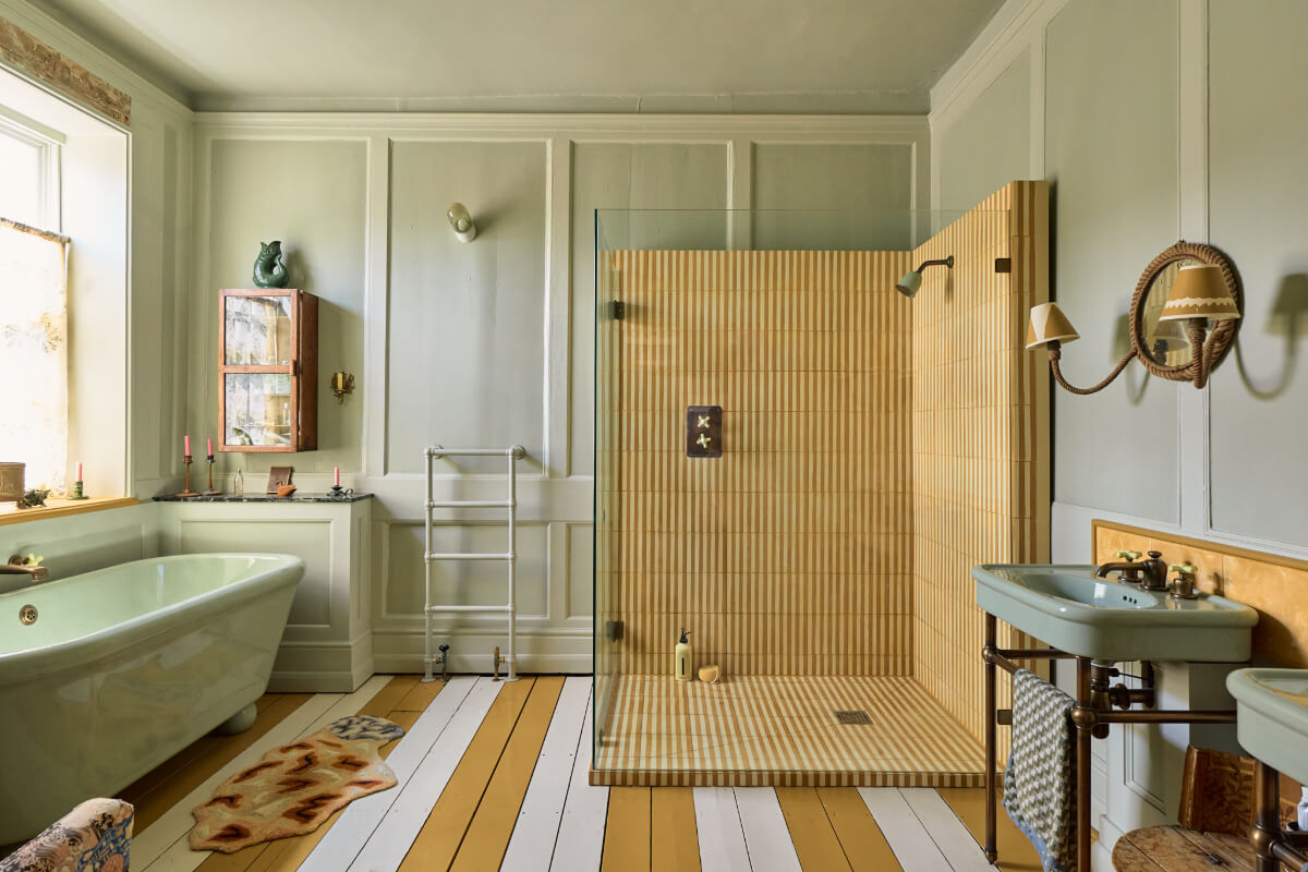 A Colorful Design-Led Georgian House in the Heart of Henley-on-Thames 28 bathroom large shower freestanding bath painted wooden floorboards