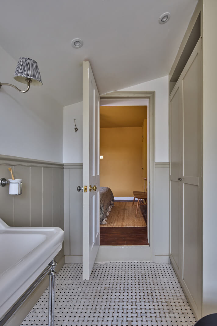 A 19th Century London Cottage with a Stunning Kitchen Extension 22 bathroom marble floor tiles built-in cabinets
