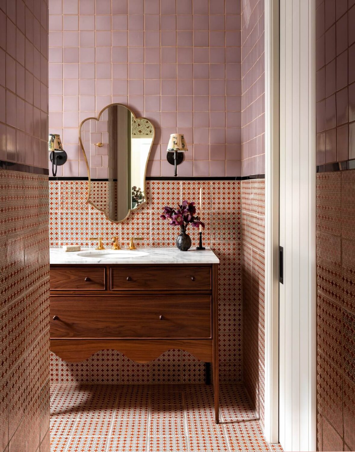 40+ Colorful Bathrooms That Will Spruce Up Your Home 17 bathroom-pink-tiles-wooden-vanity-nordroom