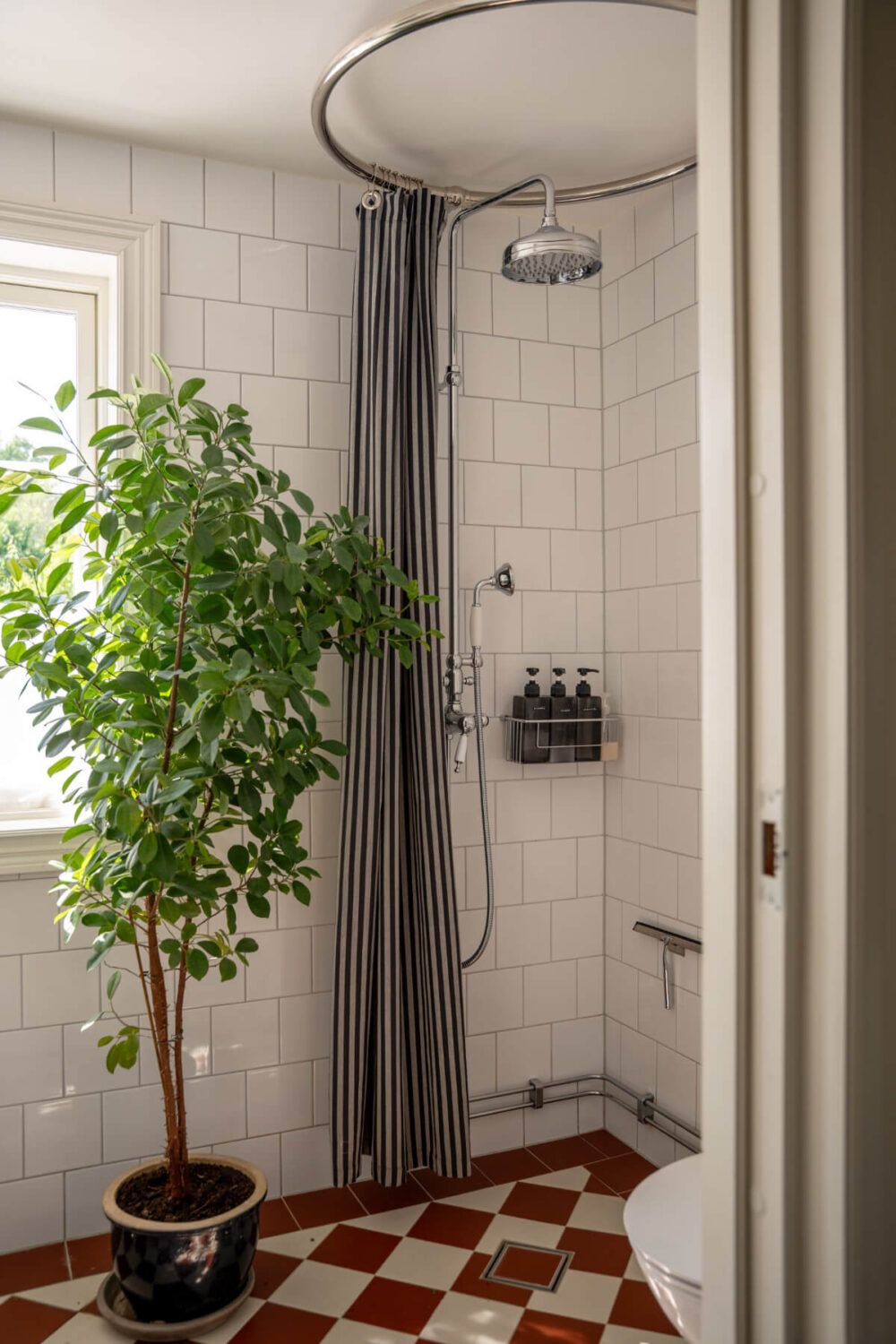 A Charming Historic Country House North of Stockholm 24 bathroom red and white checkerboard floor tiles