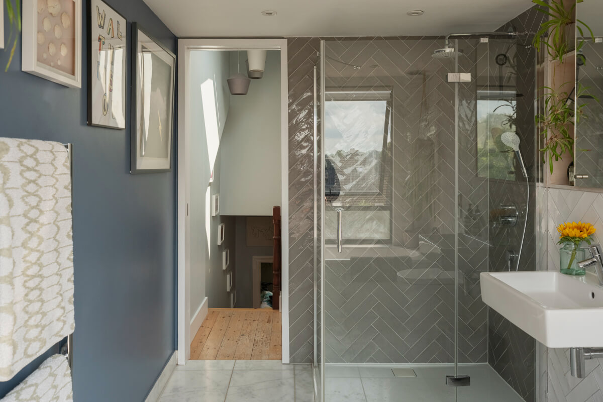 Exposed Brick and Wooden Beams in an Extended London Home 34 bathroom walk-in shower gray herringbone tiles