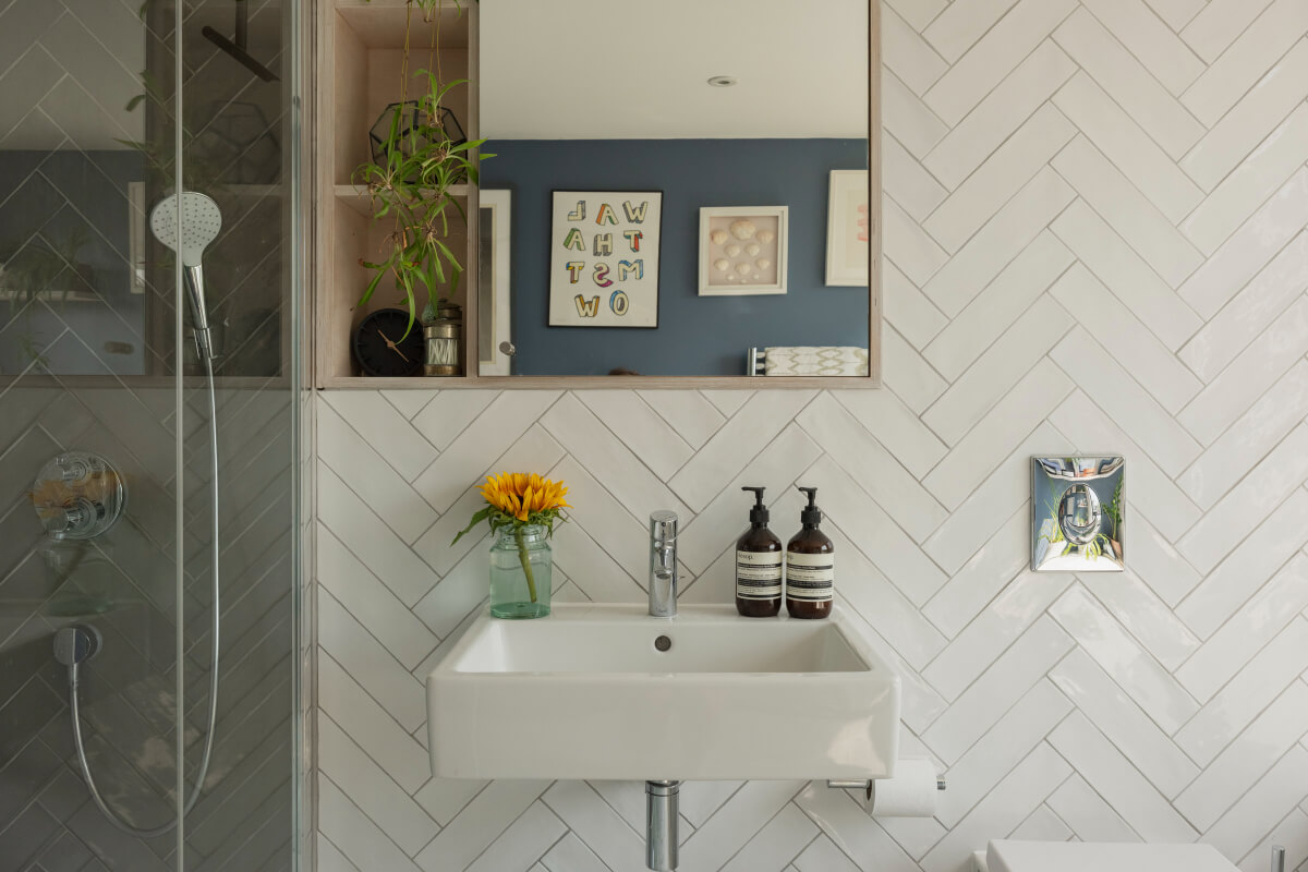 Exposed Brick and Wooden Beams in an Extended London Home 35 bathroom white herringbone tiles