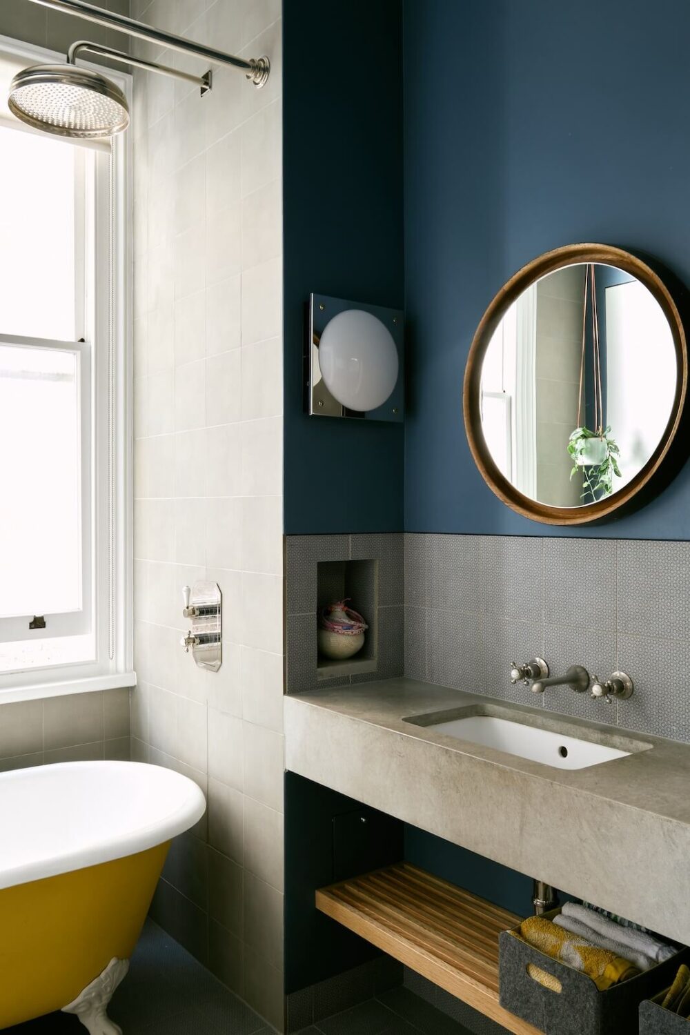 40+ Colorful Bathrooms That Will Spruce Up Your Home 40 bathroom with blue wall and yellow bath nordroom