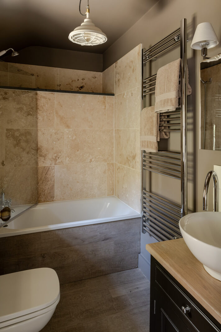 A Charming Stone Cottage with Period Features in Cornwall 20 bathroom with combined shower and bath