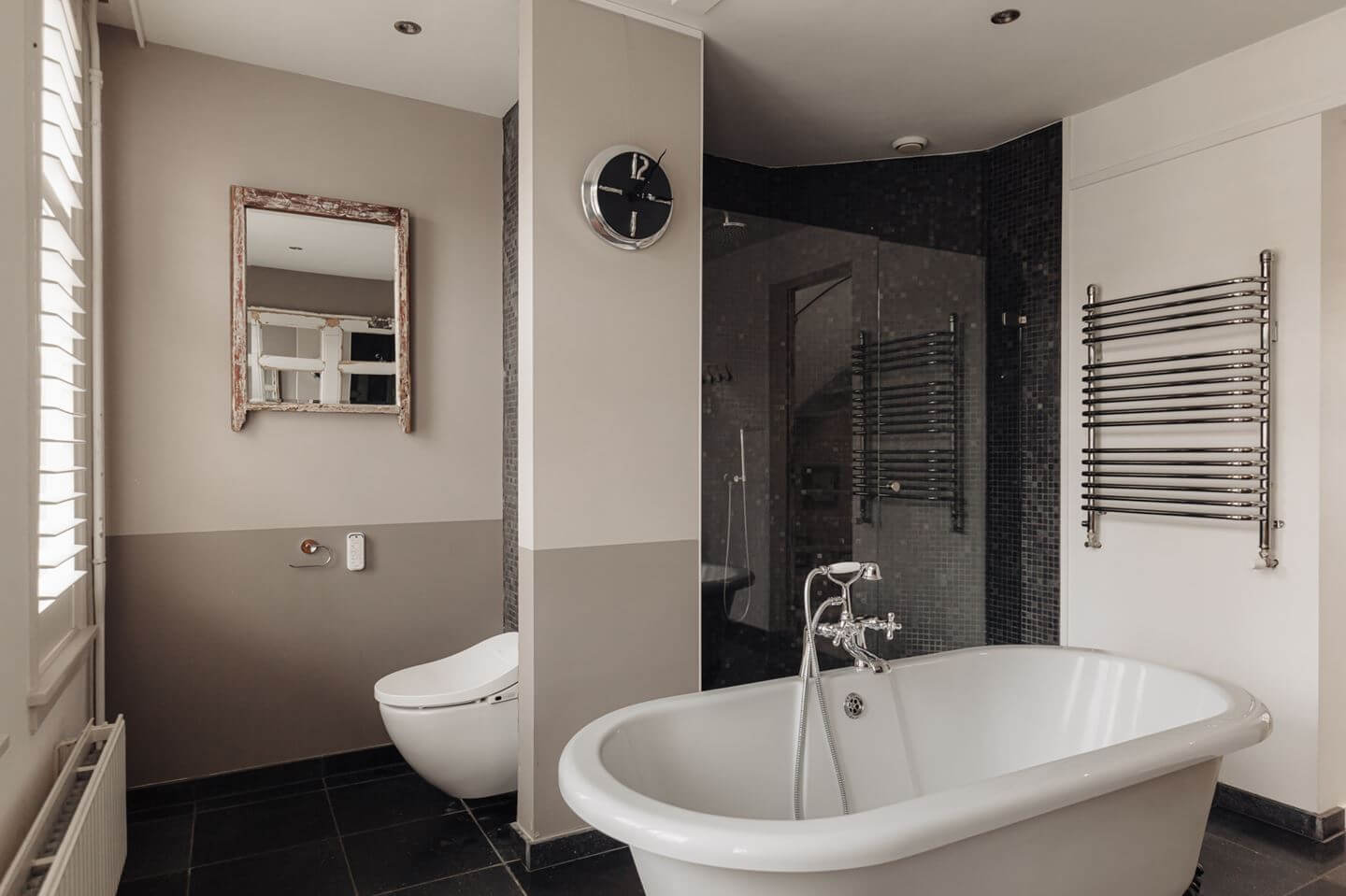 A Charming Amsterdam Townhouse with a Cozy Roof Terrace 14 bathroom with freestanding bath and black tiled shower