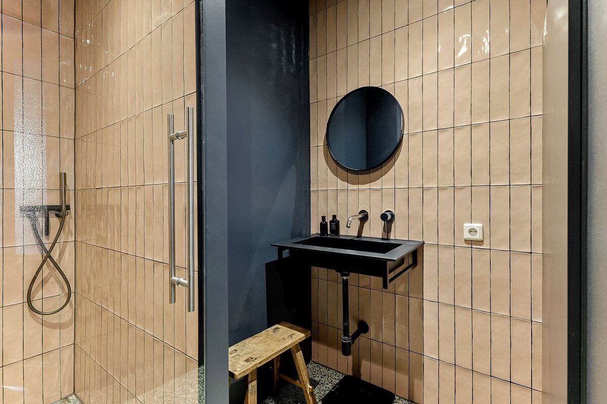 An Amsterdam Apartment with Surprising Bold Color Accents 18 bathroom with light pink tiles