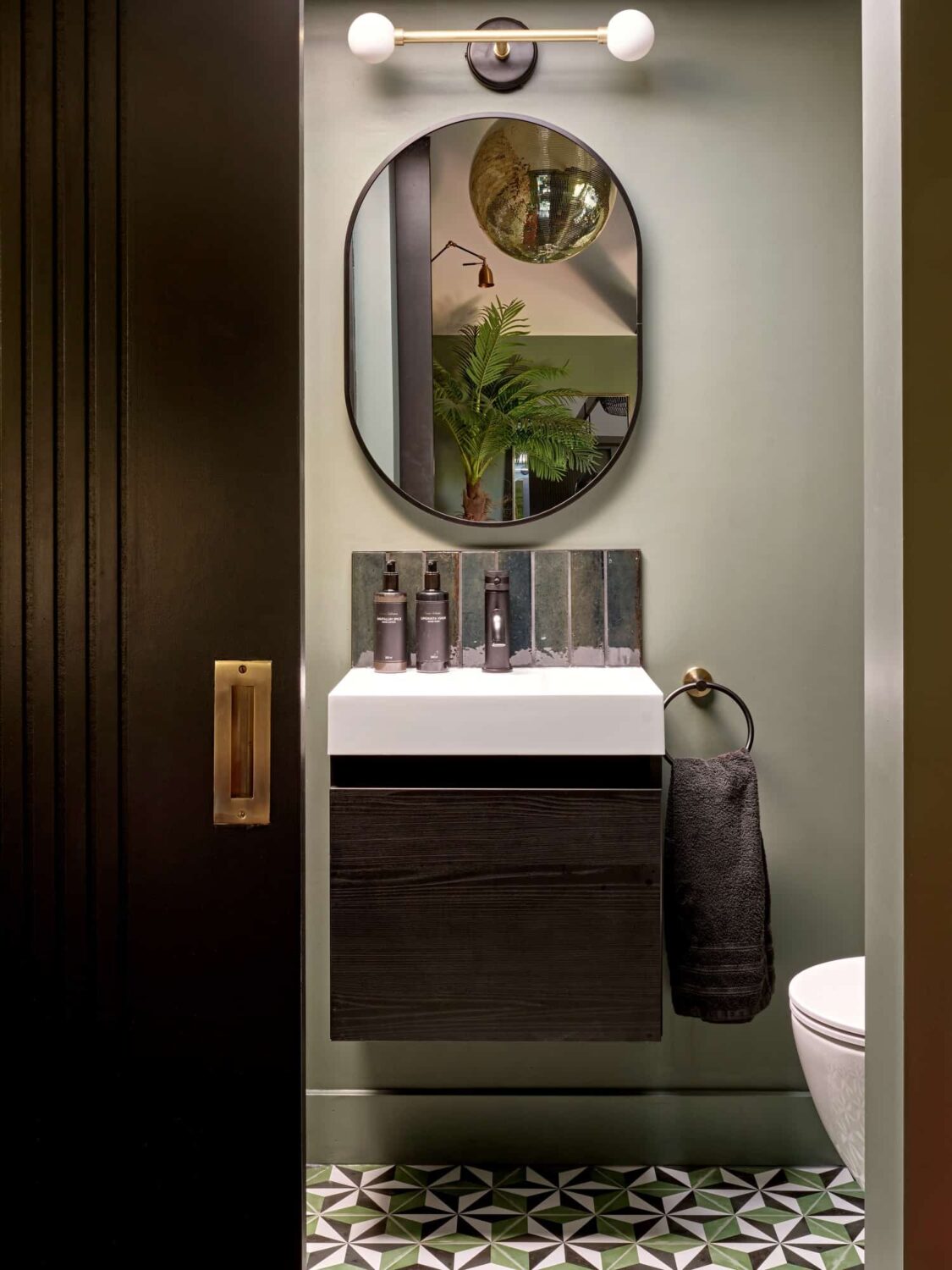 Pink & Gray Rooms in a Victorian Home with a Guest House 27 bathroom with sliding door and geometric floor tiles