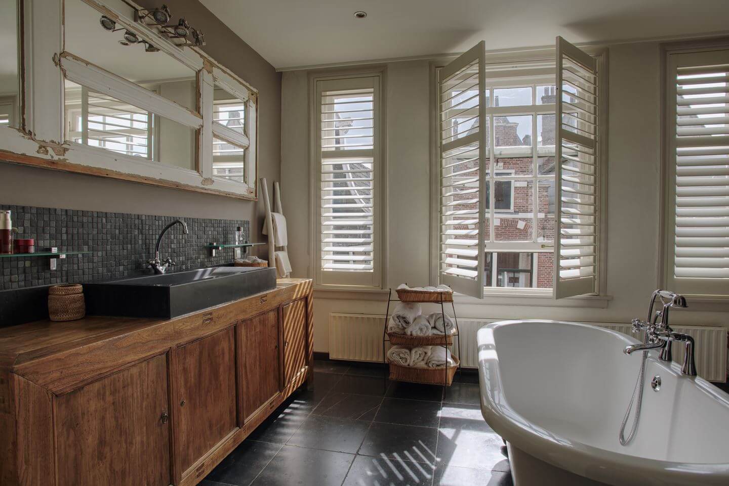 A Charming Amsterdam Townhouse with a Cozy Roof Terrace 12 bathroom with wooden vanity and bath