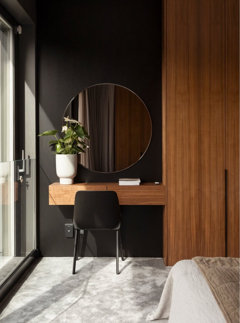A Luxurious Architect-Designed Villa in Sweden 16 bedroom black wall and floating vanity desk with round mirror nordroom