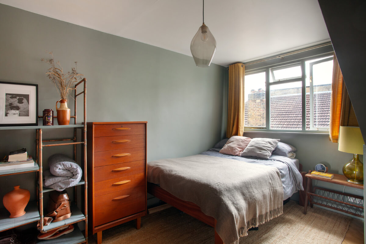 Pastel Tones and Midcentury Design in a Top Floor London Apartment 15 bedroom blue-green walls midcentury cabinet