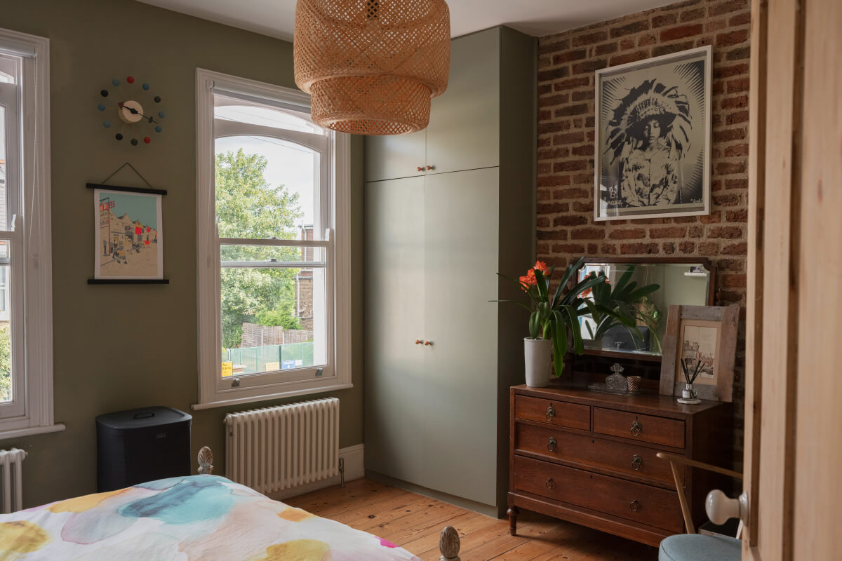 Exposed Brick and Wooden Beams in an Extended London Home 21 bedroom exposed brick wall built-in gray wardrobes