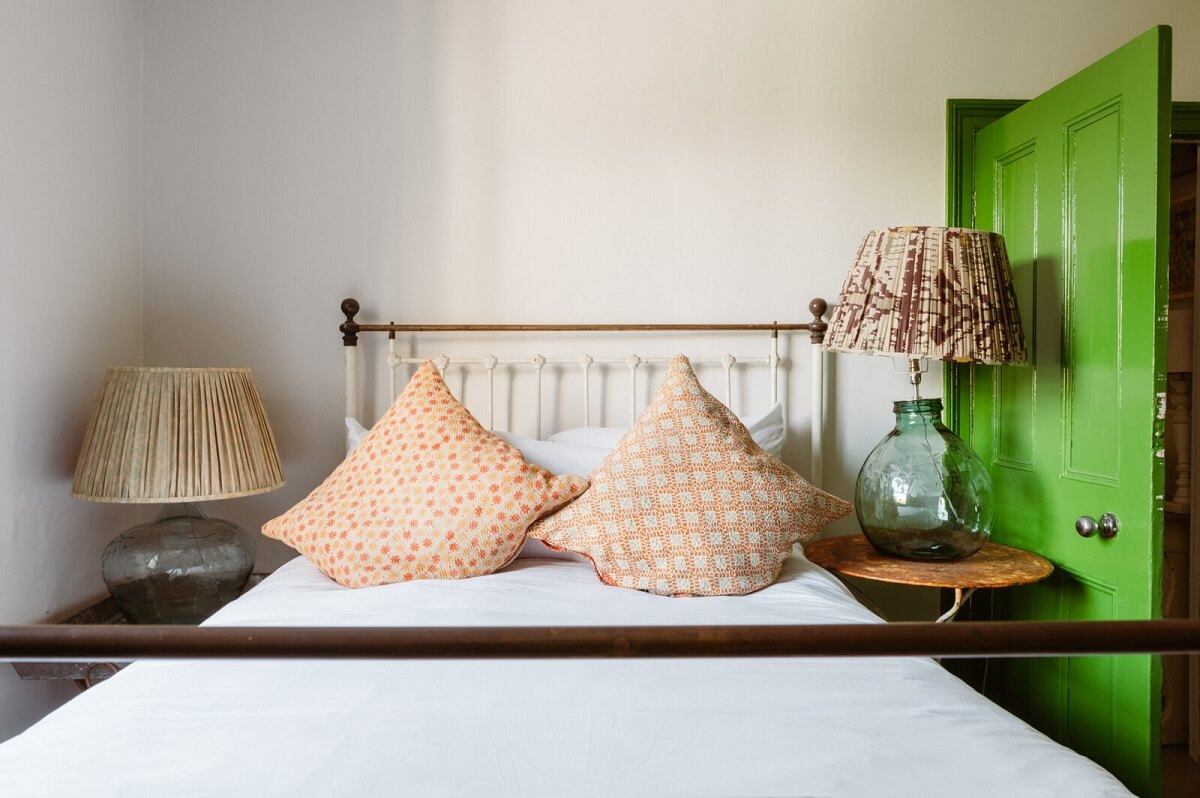 A Cozy Victorian House with Warm Color Accents 18 bedroom-green-door-nordroom