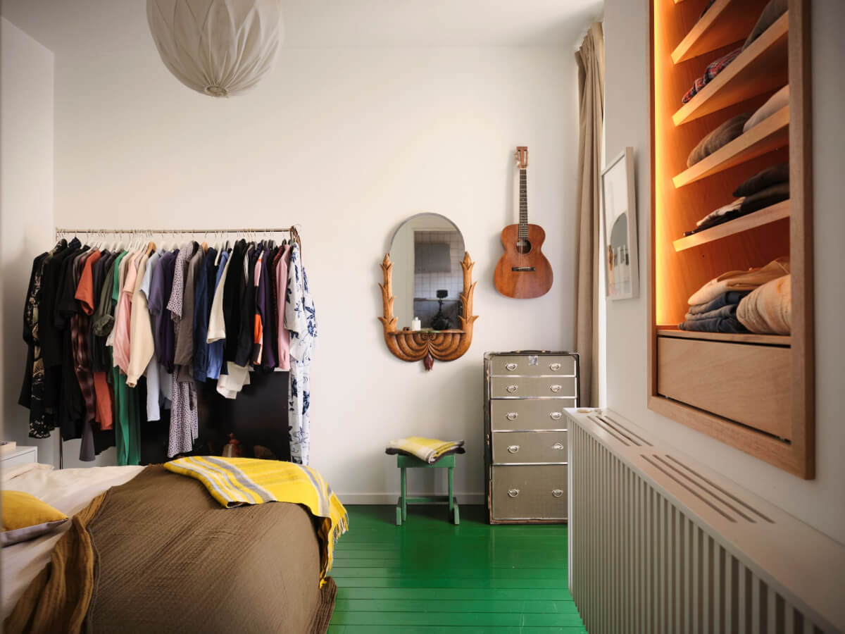 A Bright Family Apartment in a 1950s School Building 15 bedroom green painted wooden floorboards clothing rack