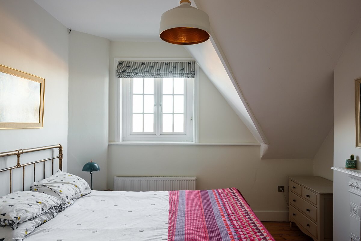 bedroom-slanted-ceiling-pink-bedspread