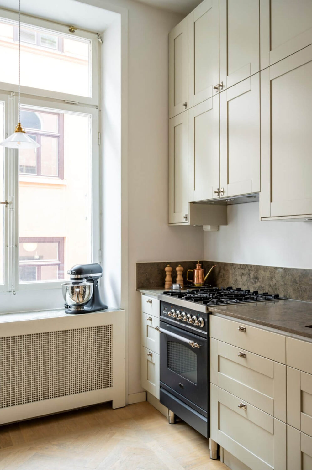 A Late 19th-Century Apartment with a Pink Bedroom 9 beige kitchen double upper cabinets
