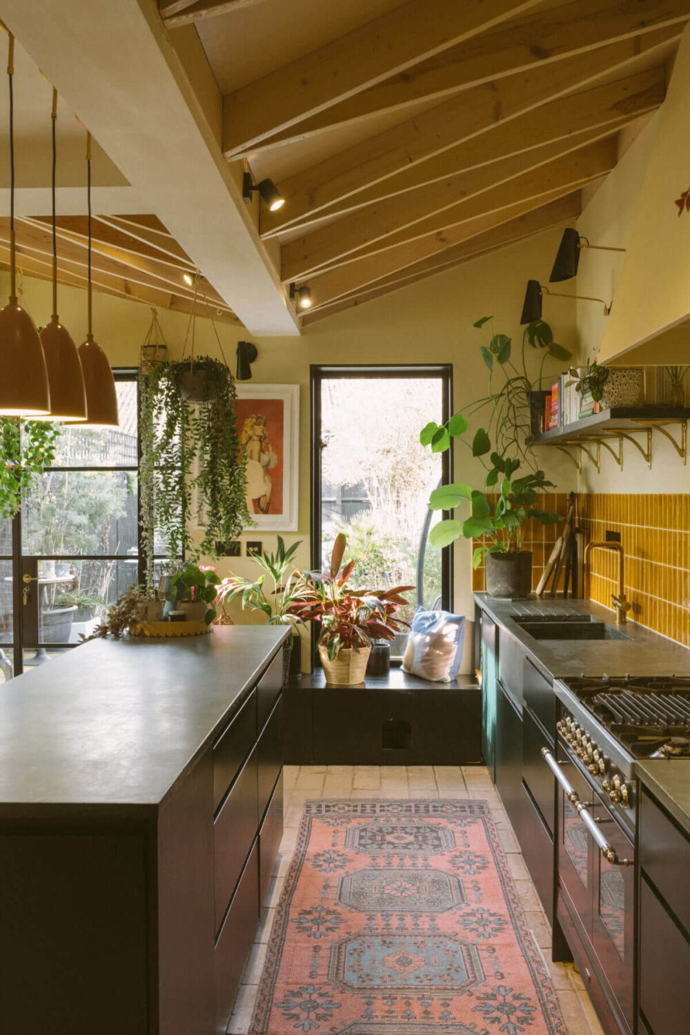 Yellow Kitchen Design Ideas (with Paint Colors) 41 black-kitchen-ochre-yellow-tiles-wooden-beams-slanted-ceiling-nordroom