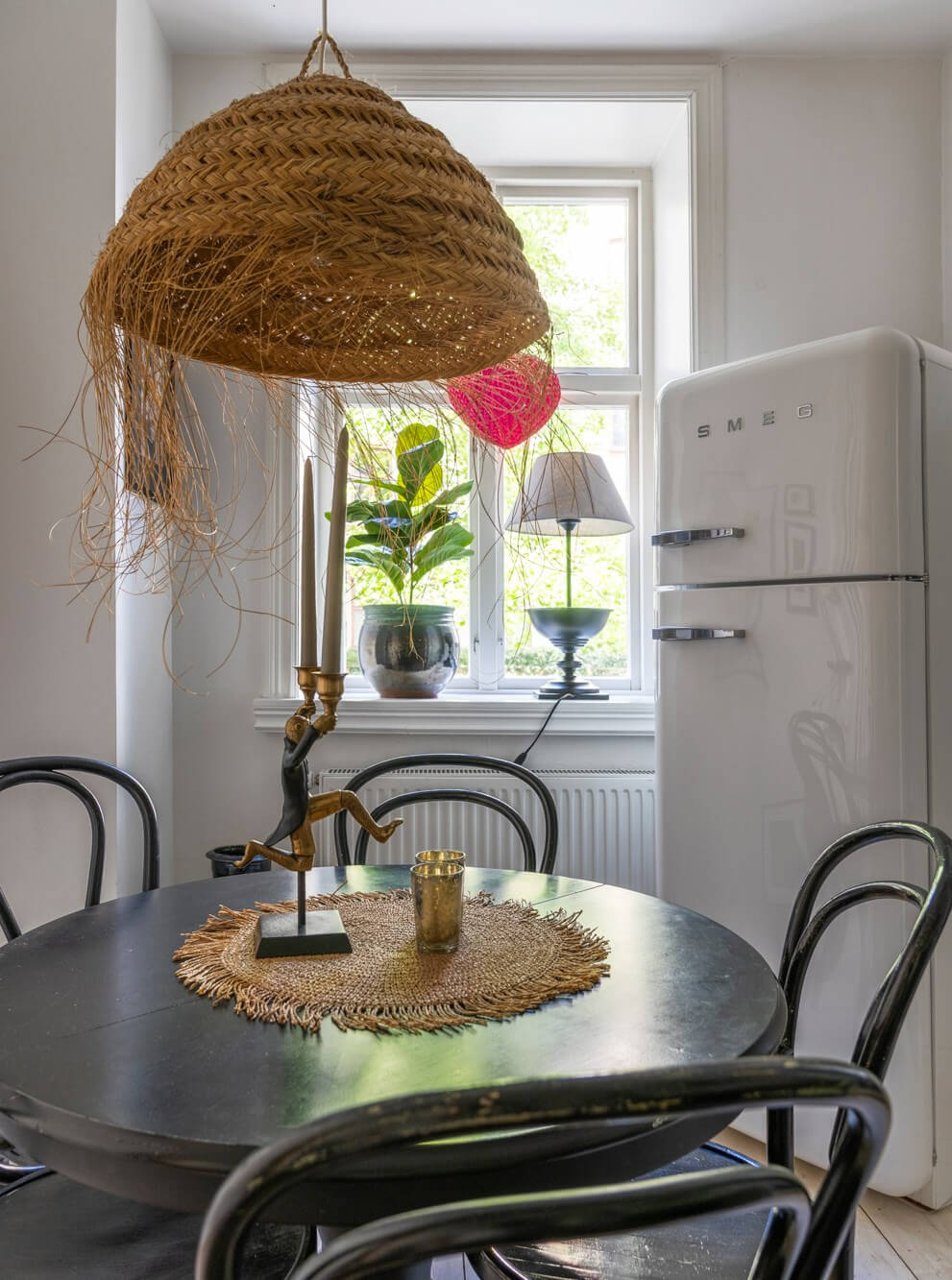 Classic Proportions and a Charming Kitchen in a Malmö Apartment 8 black round wooden kitchen table smeg fridge