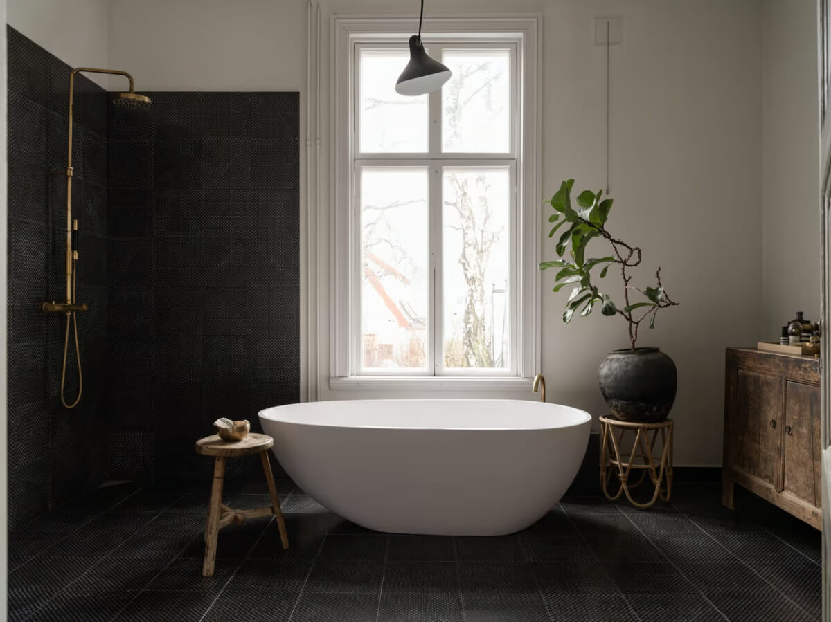 black tiled bathroom freestanding bath