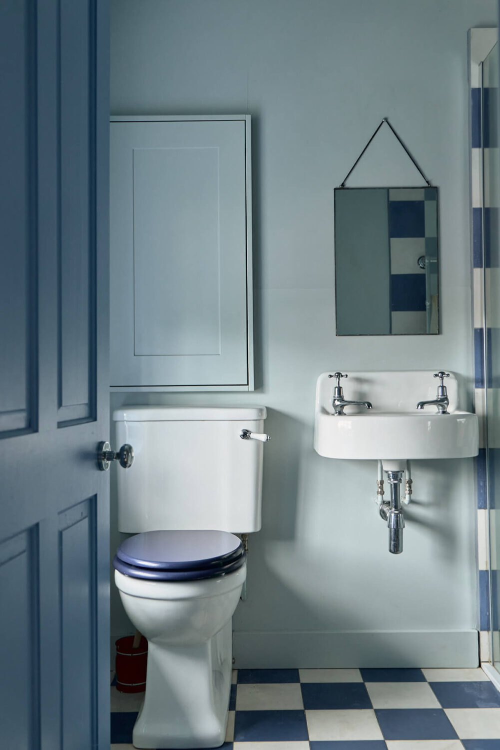 A Colorful Design-Led Georgian House in the Heart of Henley-on-Thames 40 blue bathroom with checkerboard tiles