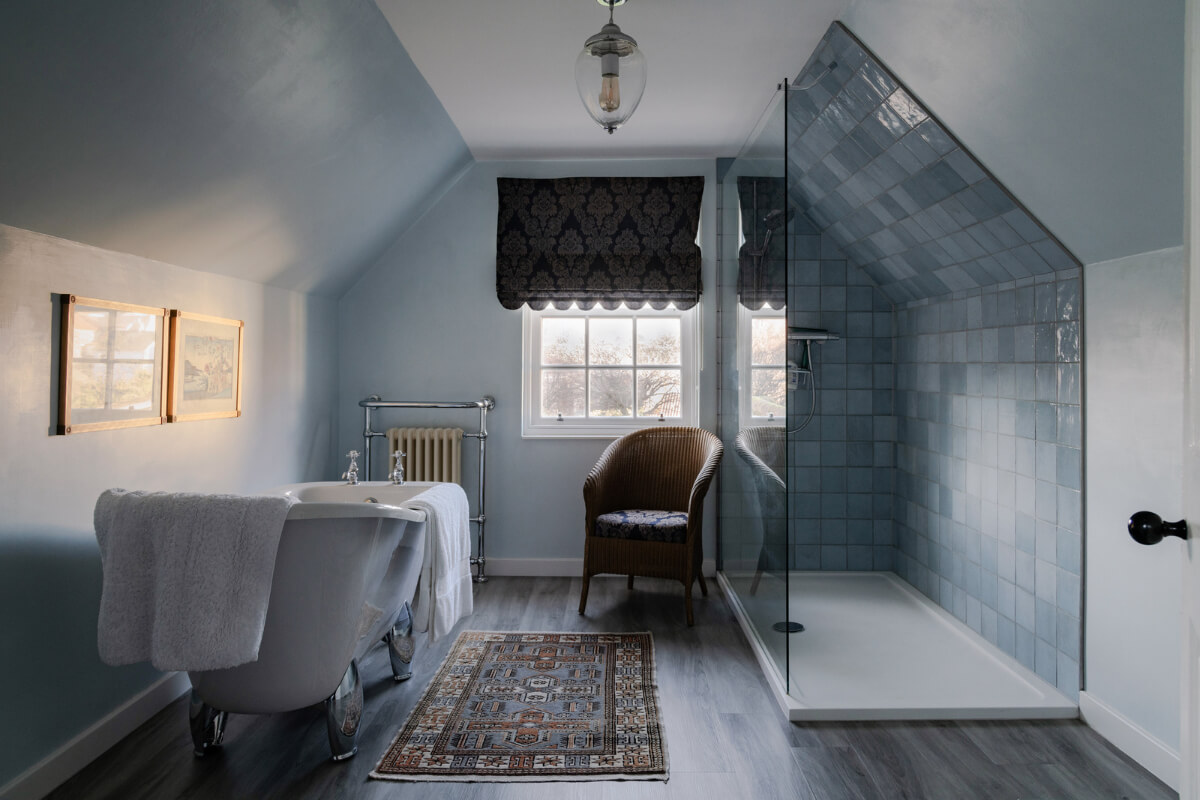 A Georgian English House Restored To Its Former Glory 22 blue bathroom with freestanding bath and walk in shower