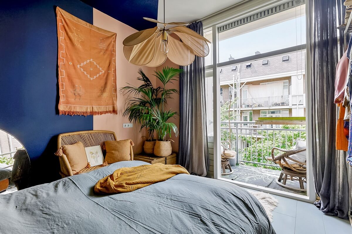 An Amsterdam Apartment with Surprising Bold Color Accents 12 blue bedroom with balcony