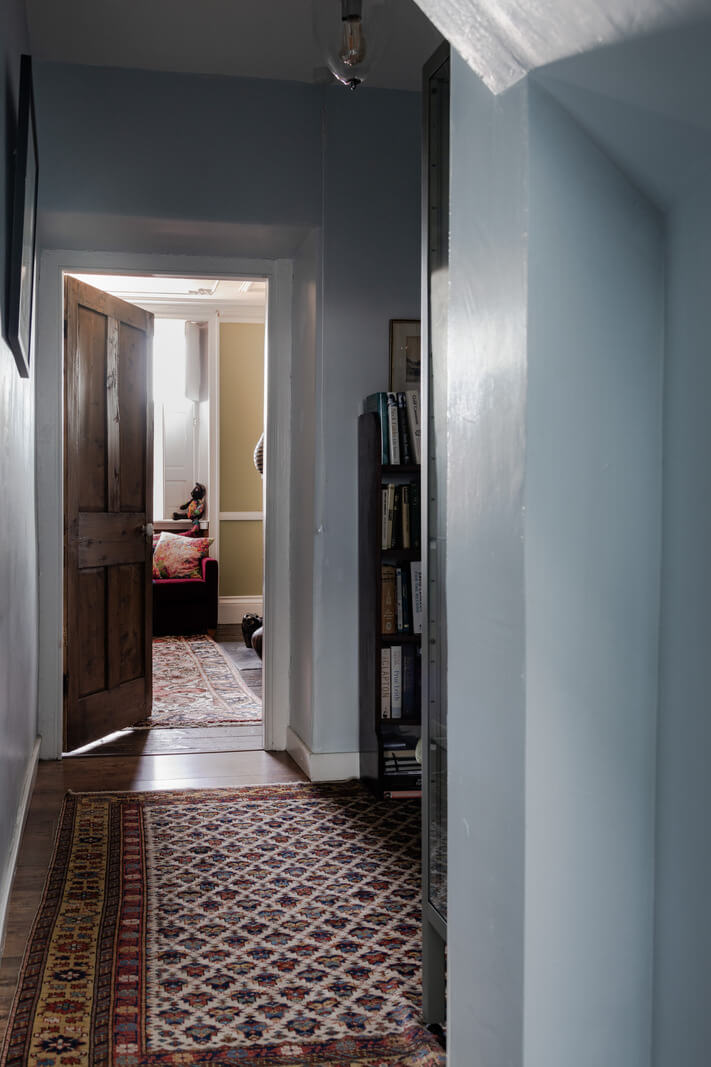 A Georgian English House Restored To Its Former Glory 15 blue hall with large vintage rug