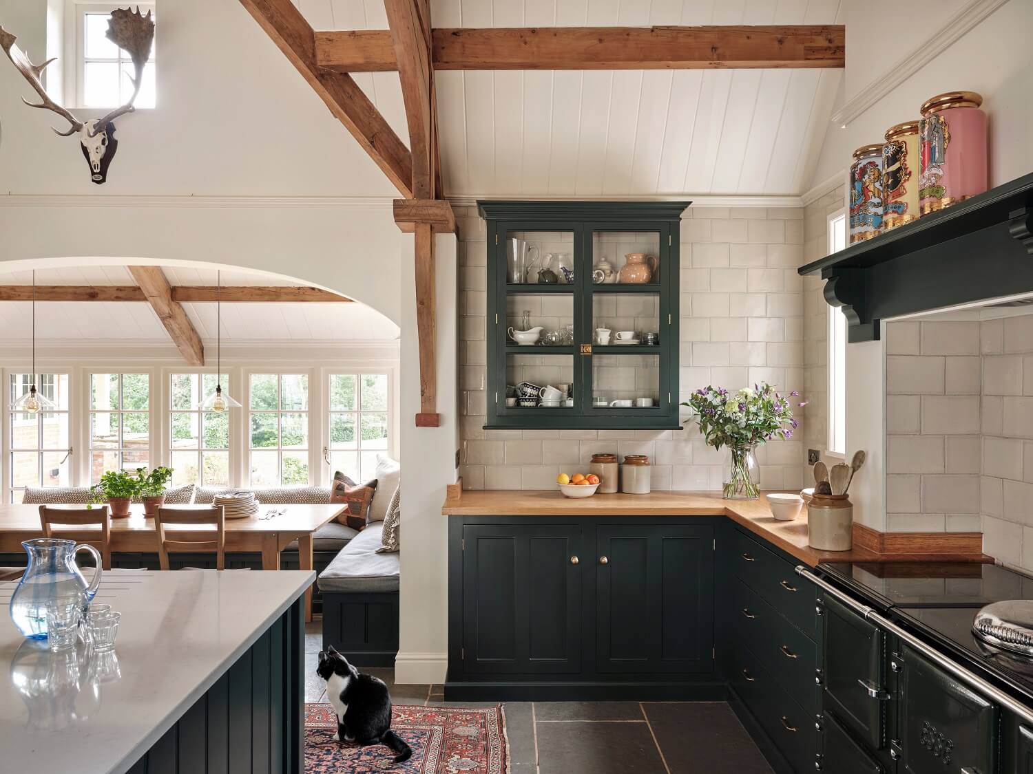 The Pros and Cons of a Wooden Kitchen Countertop 13 blue-kitchen-cabinets-devol-exposed-wooden-beams-wooden-worktop-nordroom