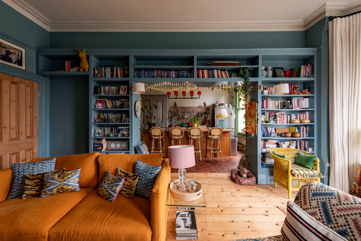 blue kitchen living room built-in bookshelves
