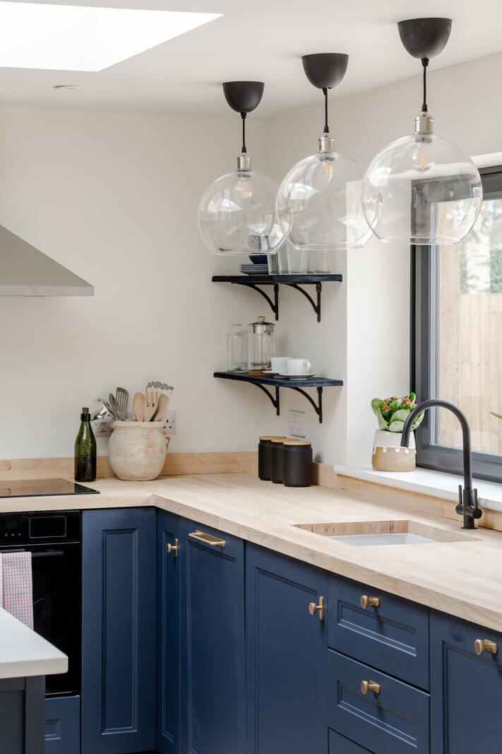 The Pros and Cons of a Wooden Kitchen Countertop 6 blue kitchen with black fittings nordroom
