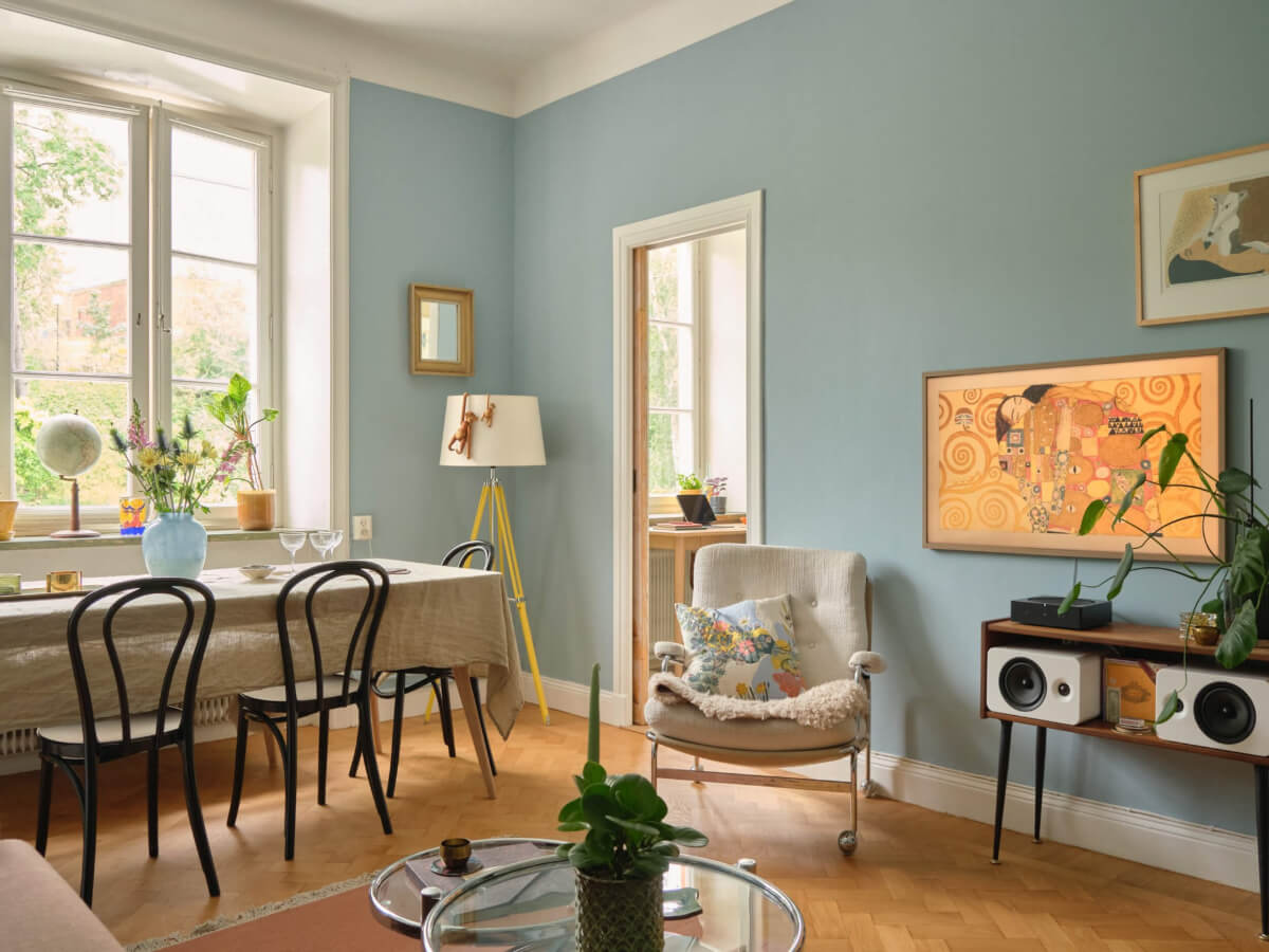 A Beautiful Color Palette and Historic Elements in a Stockholm Apartment 4 blue living room herringbone floor