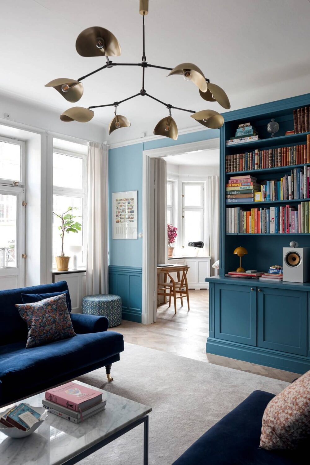 The Color Trends for 2025: Warm, Natural Shades and a Cheerful Accent 71 blue living room with built in bookcases and parquet floor nordroom