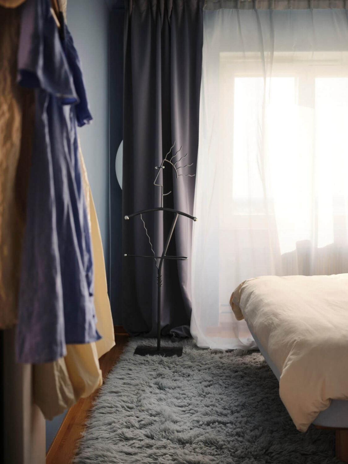 A 1940s Swedish Apartment with a Soft Yellow Kitchen 15 blue rug in bedroom