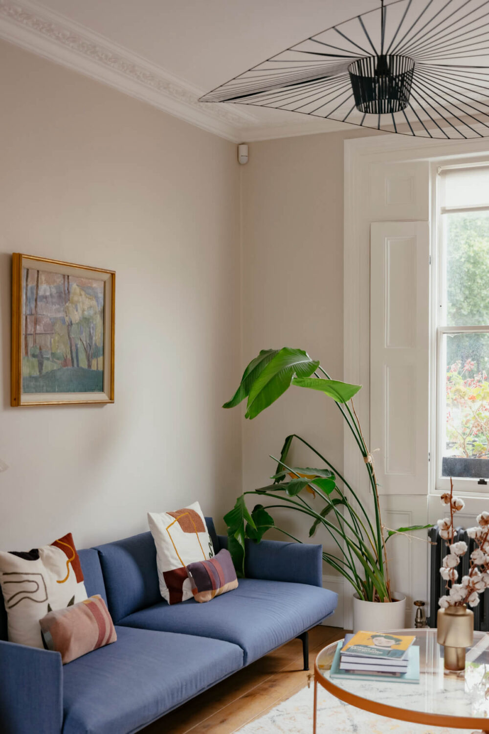 A Renovated Victorian Townhouse with a Small Split-Level Garden 3 blue sofa living room
