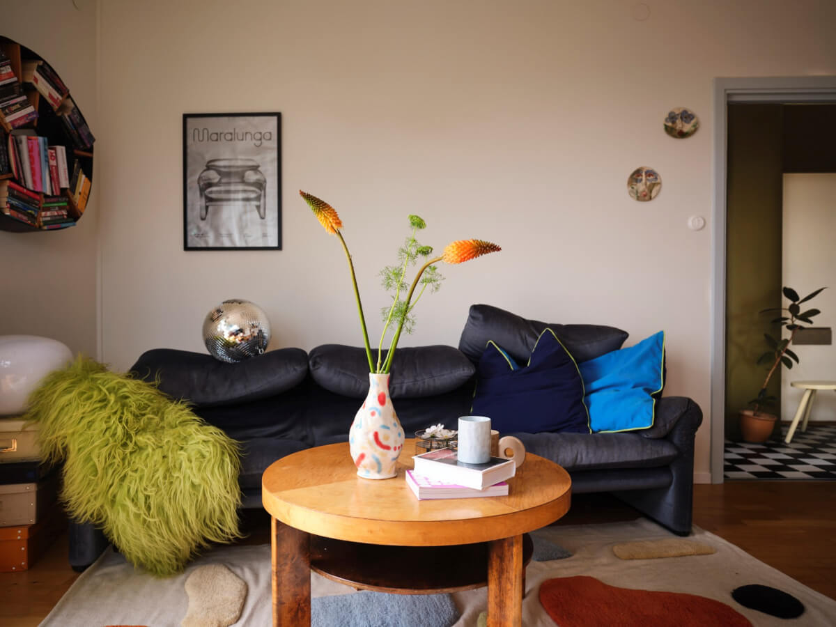 A 1940s Swedish Apartment with a Soft Yellow Kitchen 7 blue sofa living room