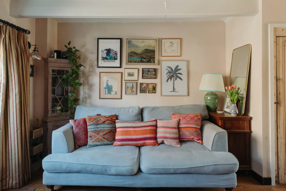 A Historic English Cottage Decorated in Pink & Blue Tones 3 blue sofa small cottage living room