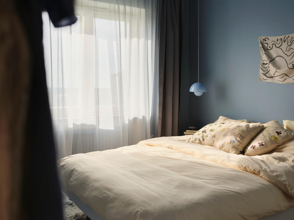 A 1940s Swedish Apartment with a Soft Yellow Kitchen 14 blue walls bedroom yellow bedding