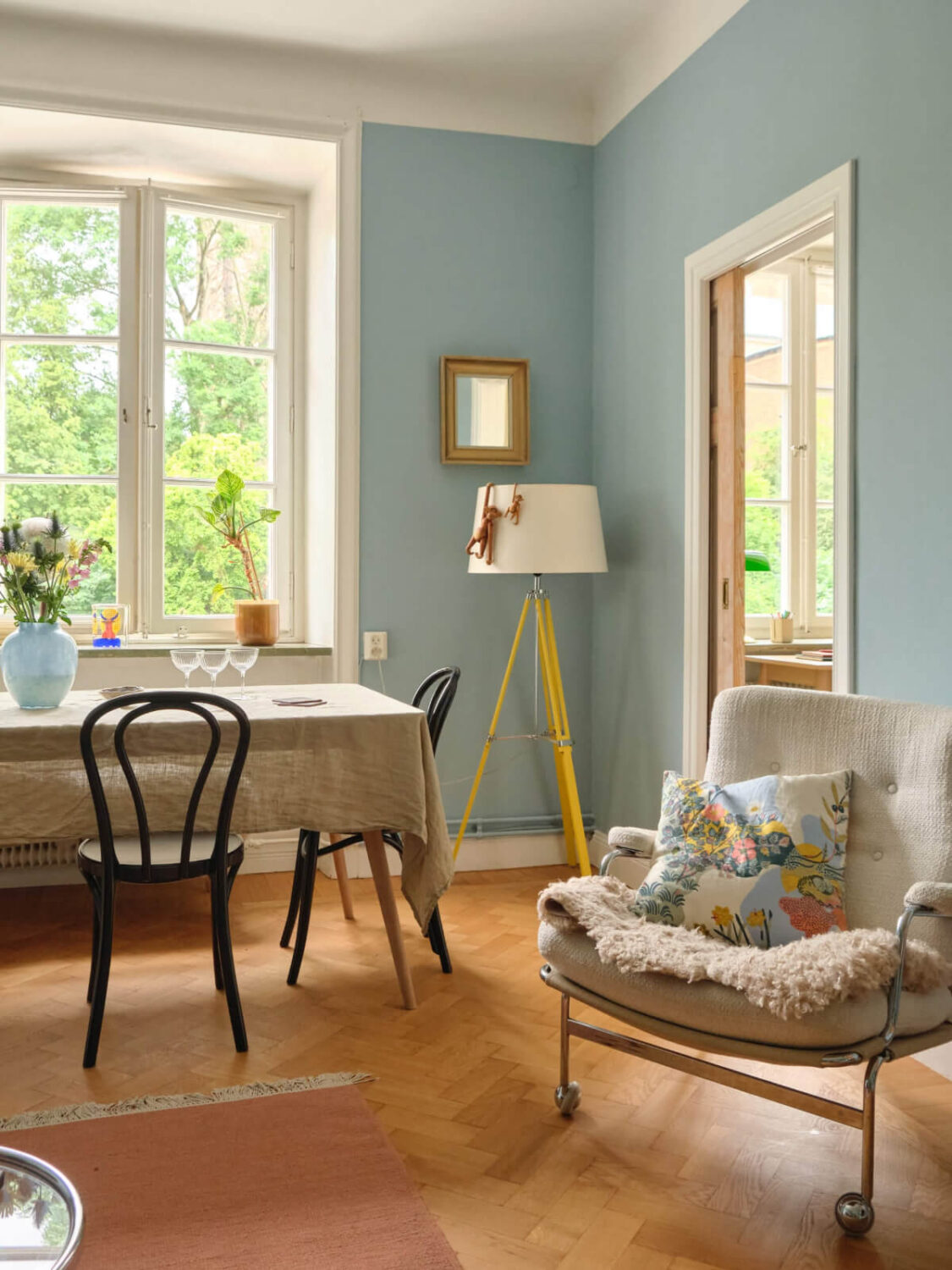 A Beautiful Color Palette and Historic Elements in a Stockholm Apartment 6 blue walls living room herringbone parquet floor