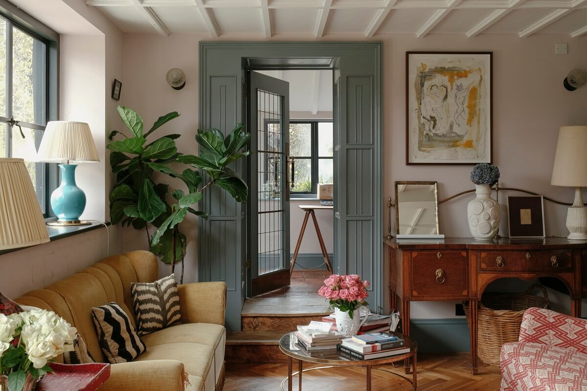 A Barn House with Vintage Decor and Exposed Beams 2 blue wooden doors in open plan living room kitchen