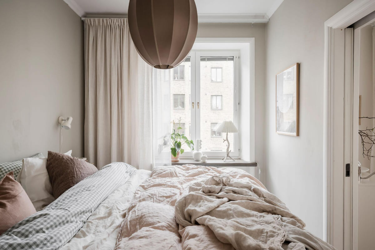 A Light Corner Apartment with an Open Flowing Floor Plan 29 blush colored bedding