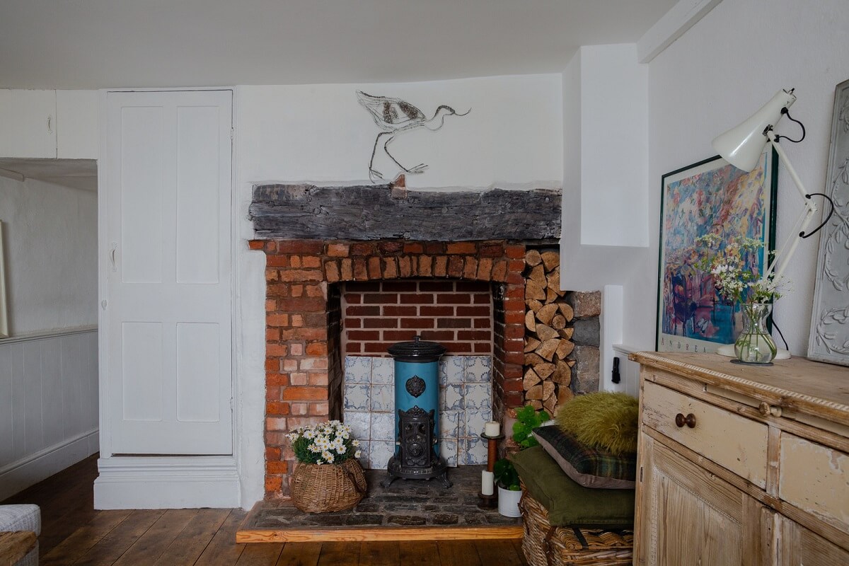 A Charming 400-Year-Old Cottage in England 6 brick fireplace